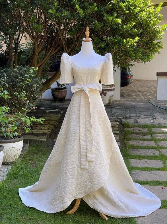 Modern Filipiniana floor length wedding gown with butterfly sleeves.