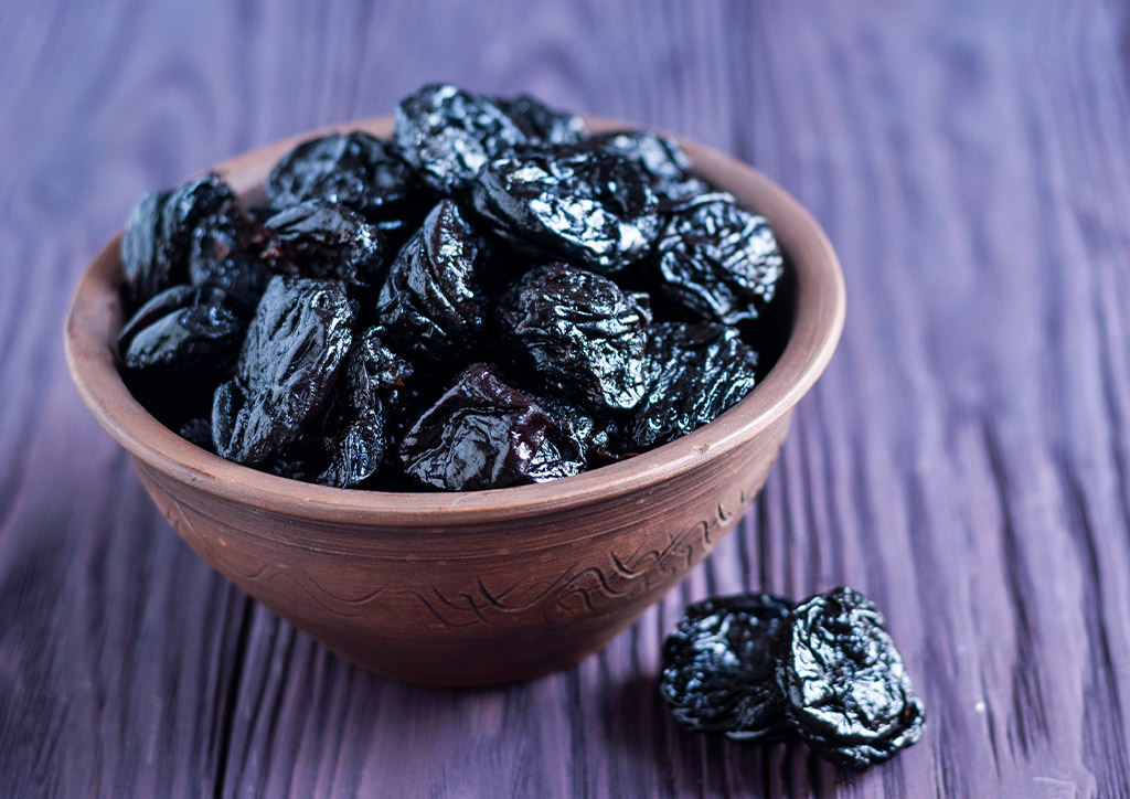 Prunes or dried plums for constipation